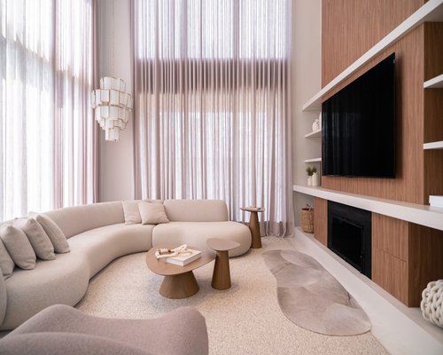 Soft natural light filtering through sheer curtains into a calm room